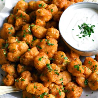 Crispy fried cauliflower wings with buffalo sauce.