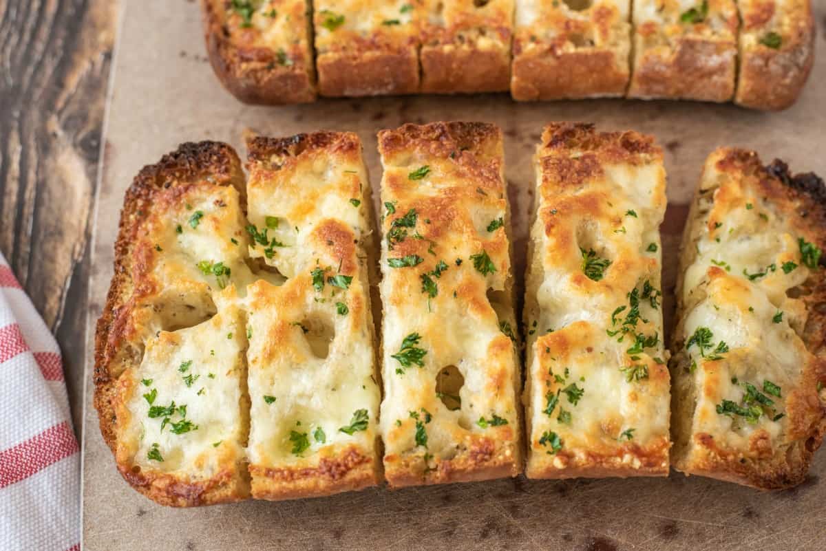 sliced garlic bread with cheese melted on top