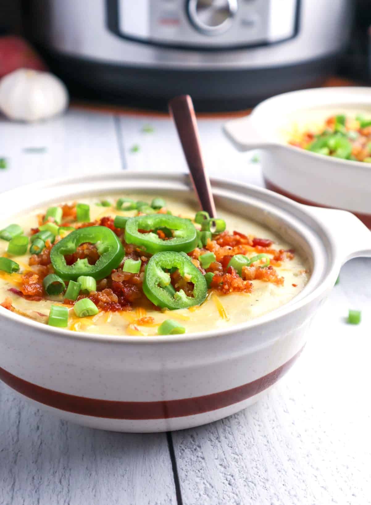 Instant Pot potato soup loaded with cheese, bacon, and jalapenos.