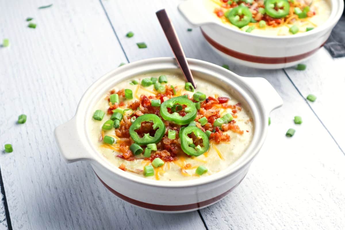 White soup crock filled with loaded potato soup.