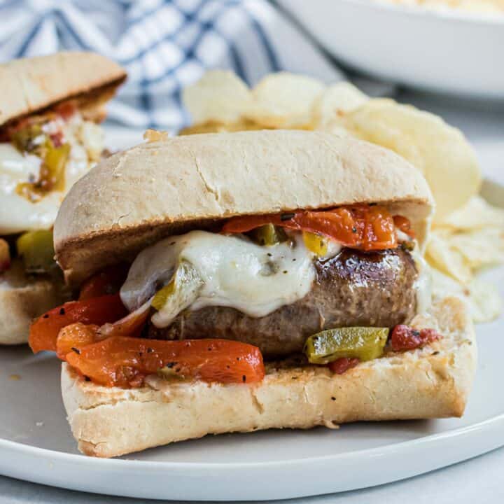 Sausage and peppers on french roll with melted provolone cheese.