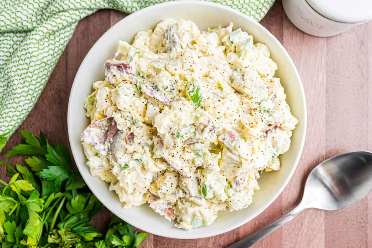 Potato salad garnished with parsley.