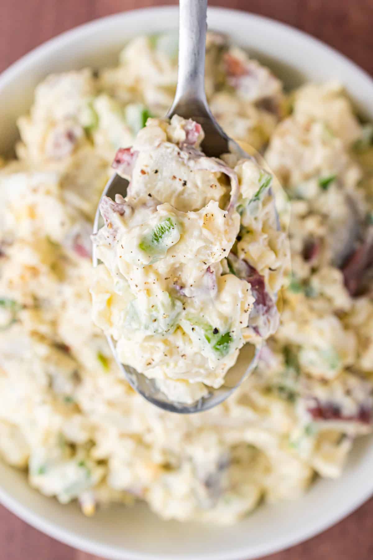 Potato salad recipe with chunks of peppers, onions, eggs, and creamy mayonnaise.