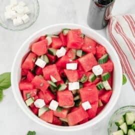 Watermelon salad with feta, cucumber, mint, basil, and lime juice.