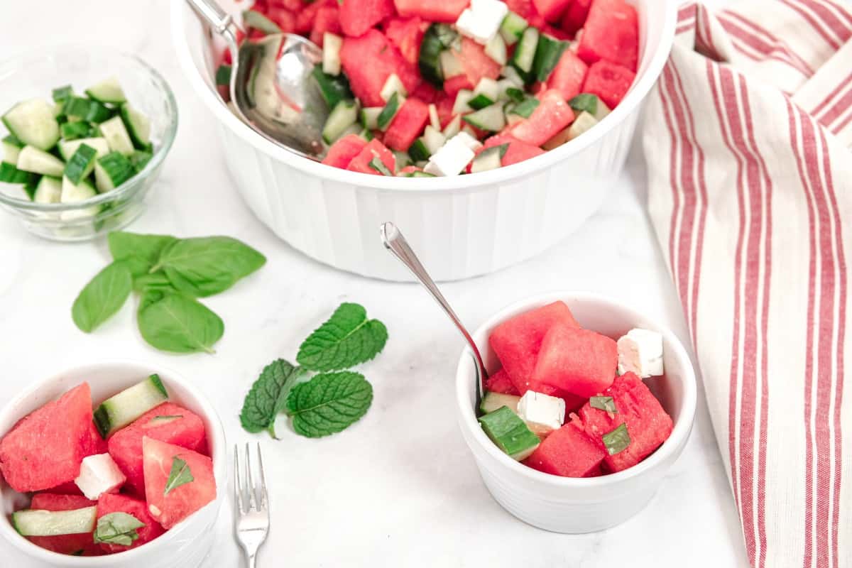 Watermelon salad in small white ramekins for serving.