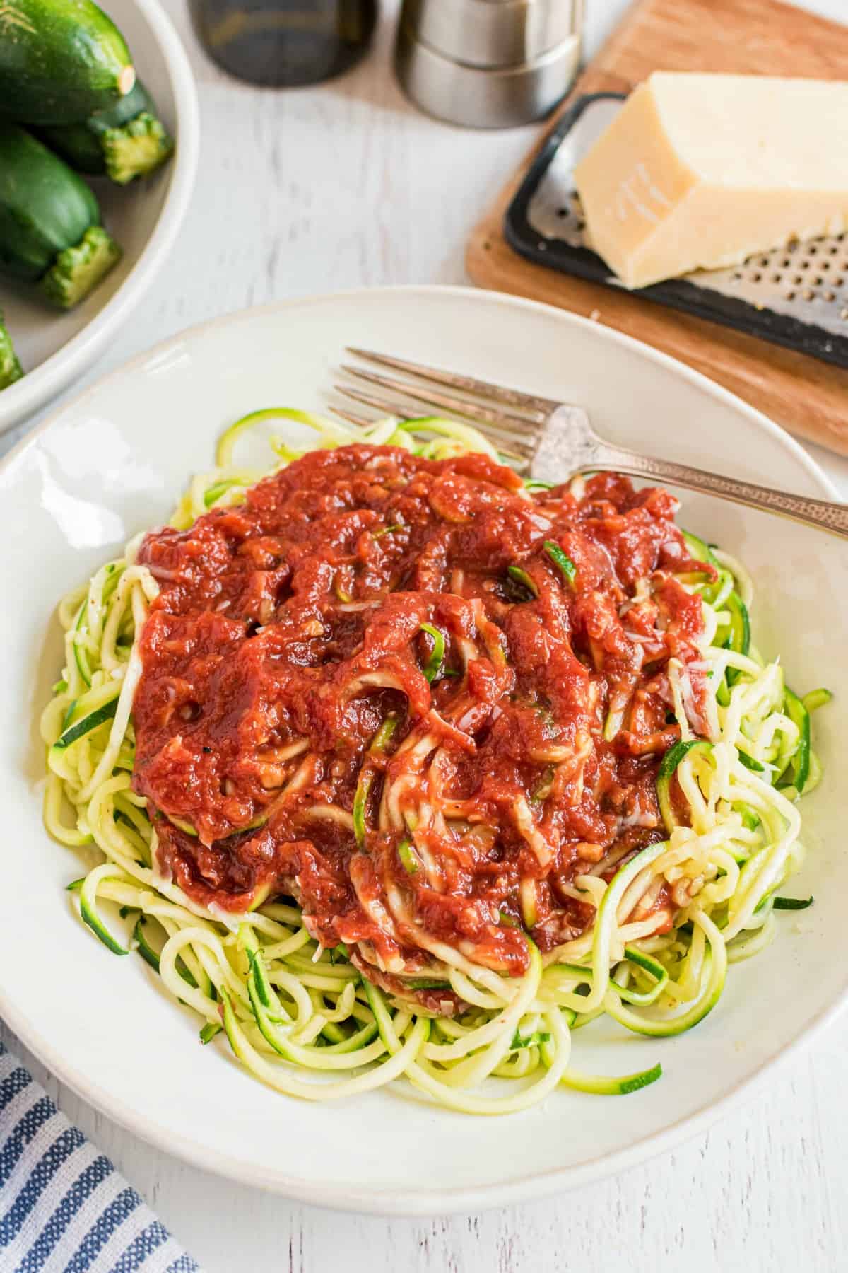 Zoodles topped with marinara sauce.