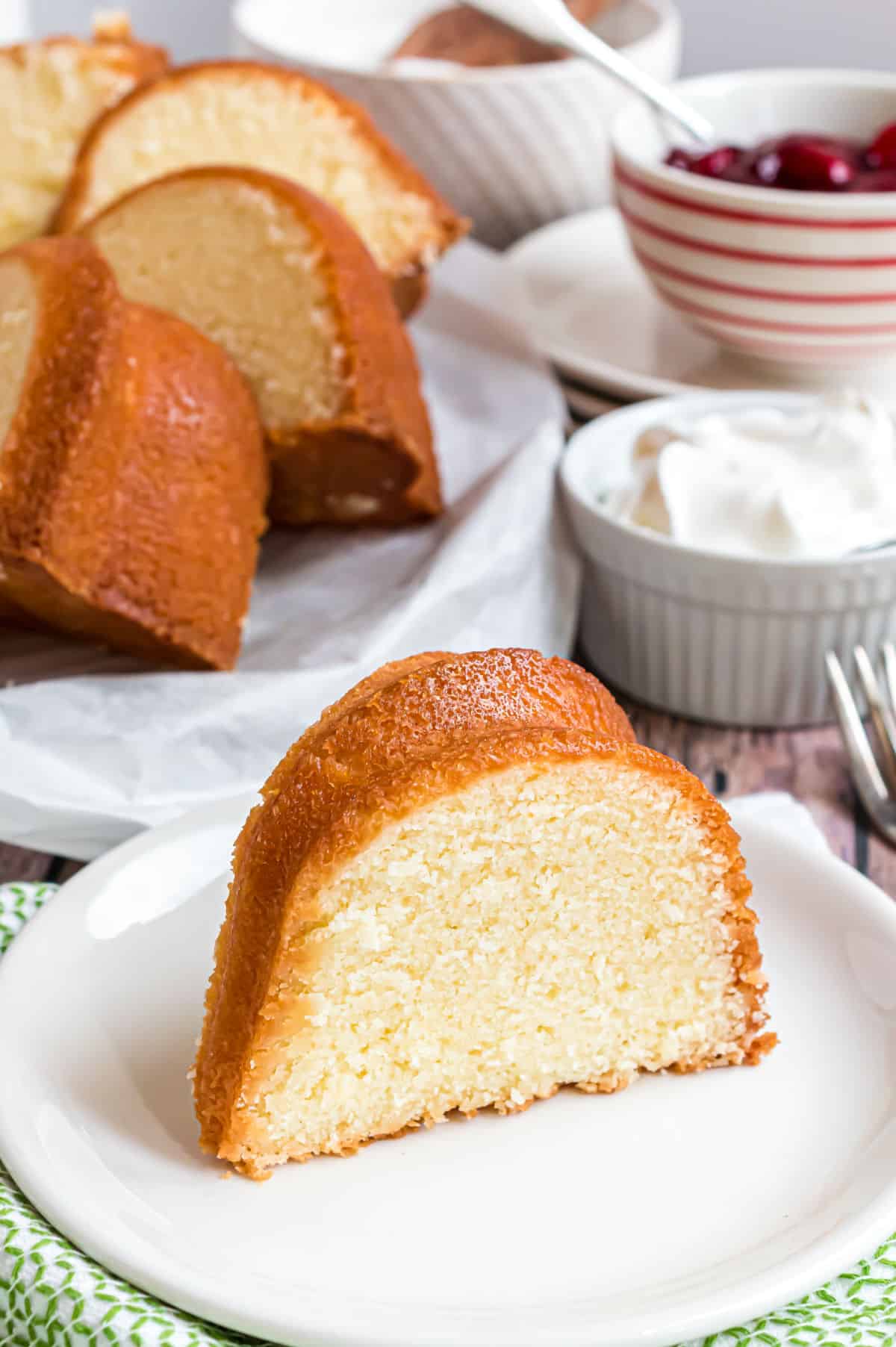 Slice of pound cake on a white plate.