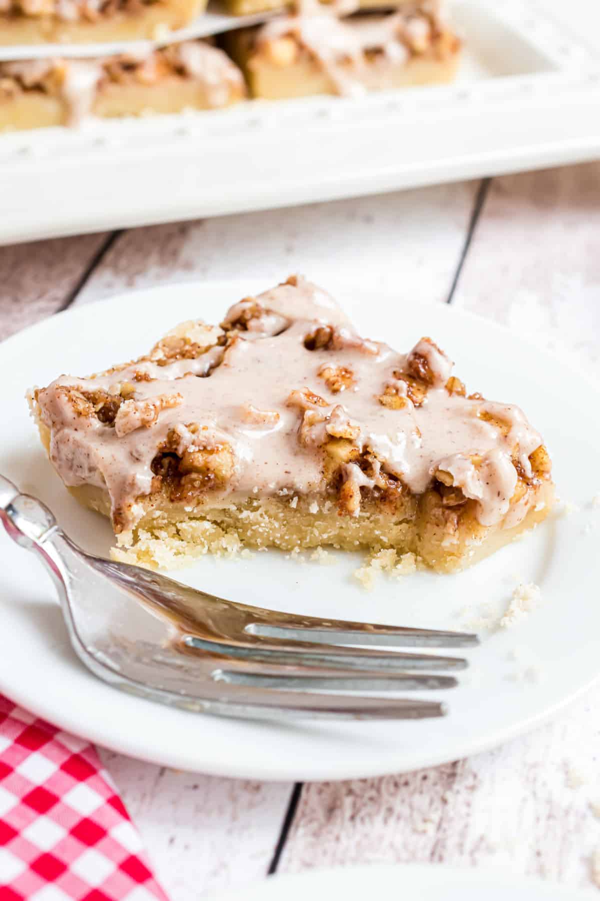 Apple shortbread bars with a bite taken out.