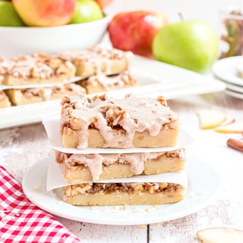 Three apple shortbread bars stacked on top of each other.