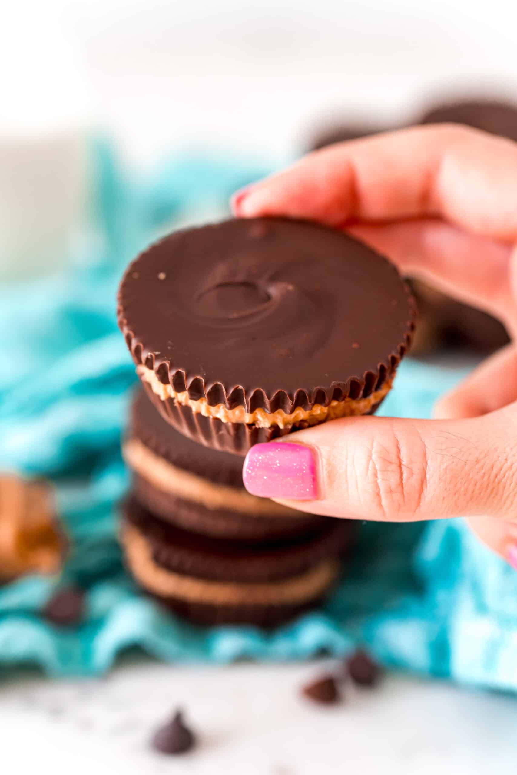 Homemade peanut butter cup being held.