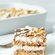 Slice of smores icebox cake on a white dessert plate.