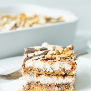 Slice of smores icebox cake on a white dessert plate.