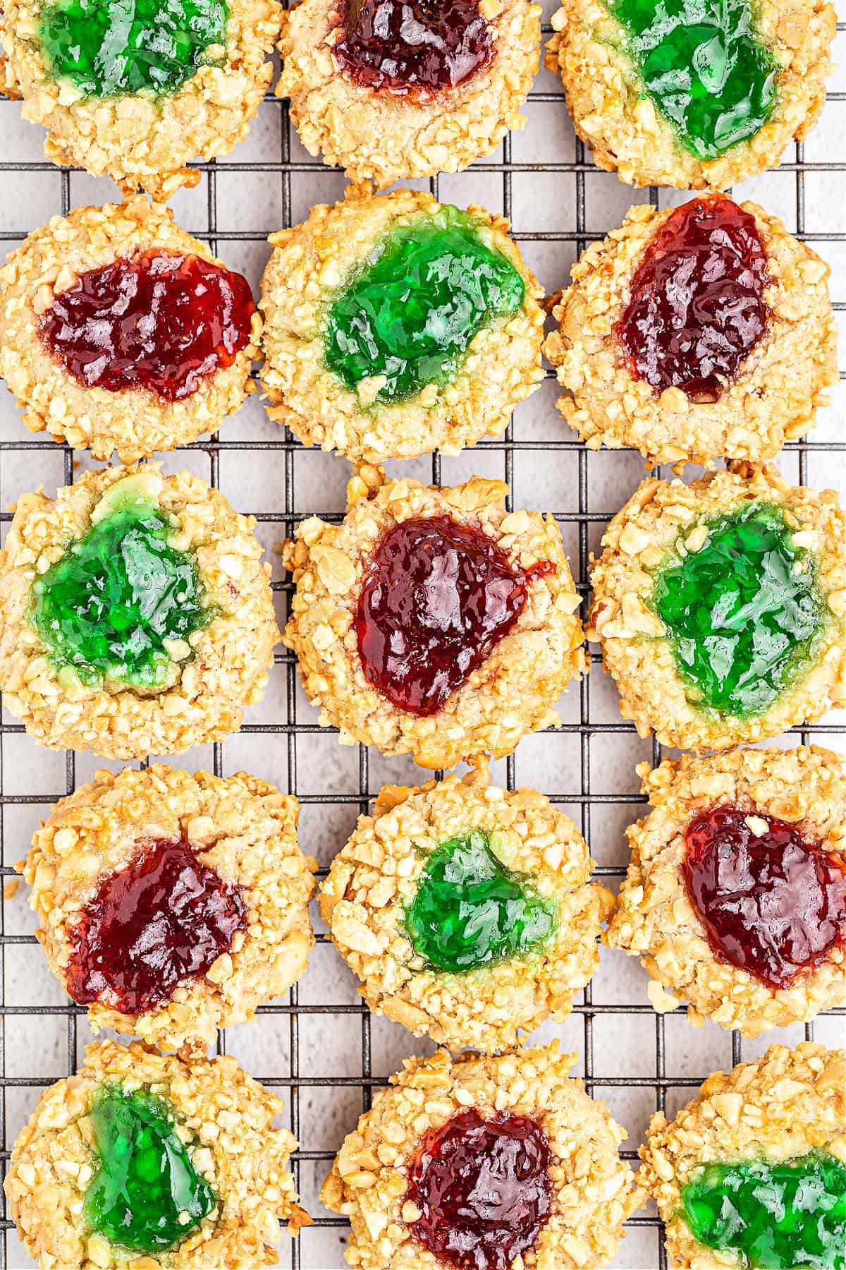 Thumbprint cookies on a wire cooling rack.