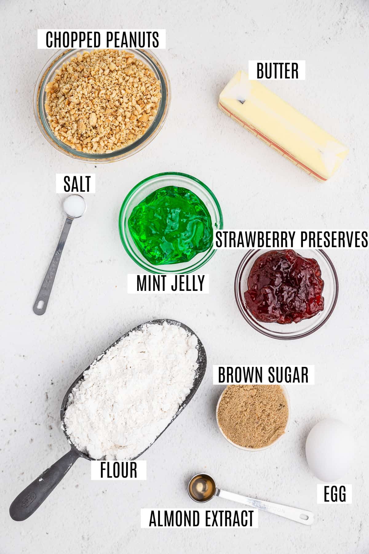 Ingredients needed to make thumbprint cookies with jam.