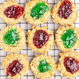 You can never have too many Christmas Cookies, especially when they're as good as these! Jelly Thumbprint Cookies are packed with peanuts and a sweet jelly center. They're so delicious you're going to want to keep them all to yourself!
