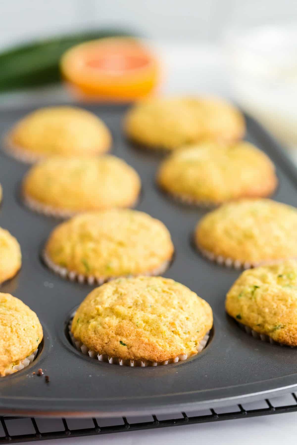 Zucchini muffins in cupcake tin without glaze.