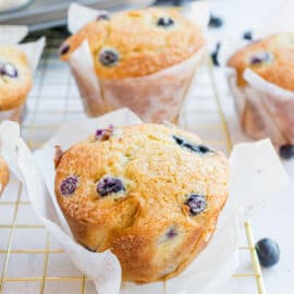 Blueberry muffins on wire cooling rack.