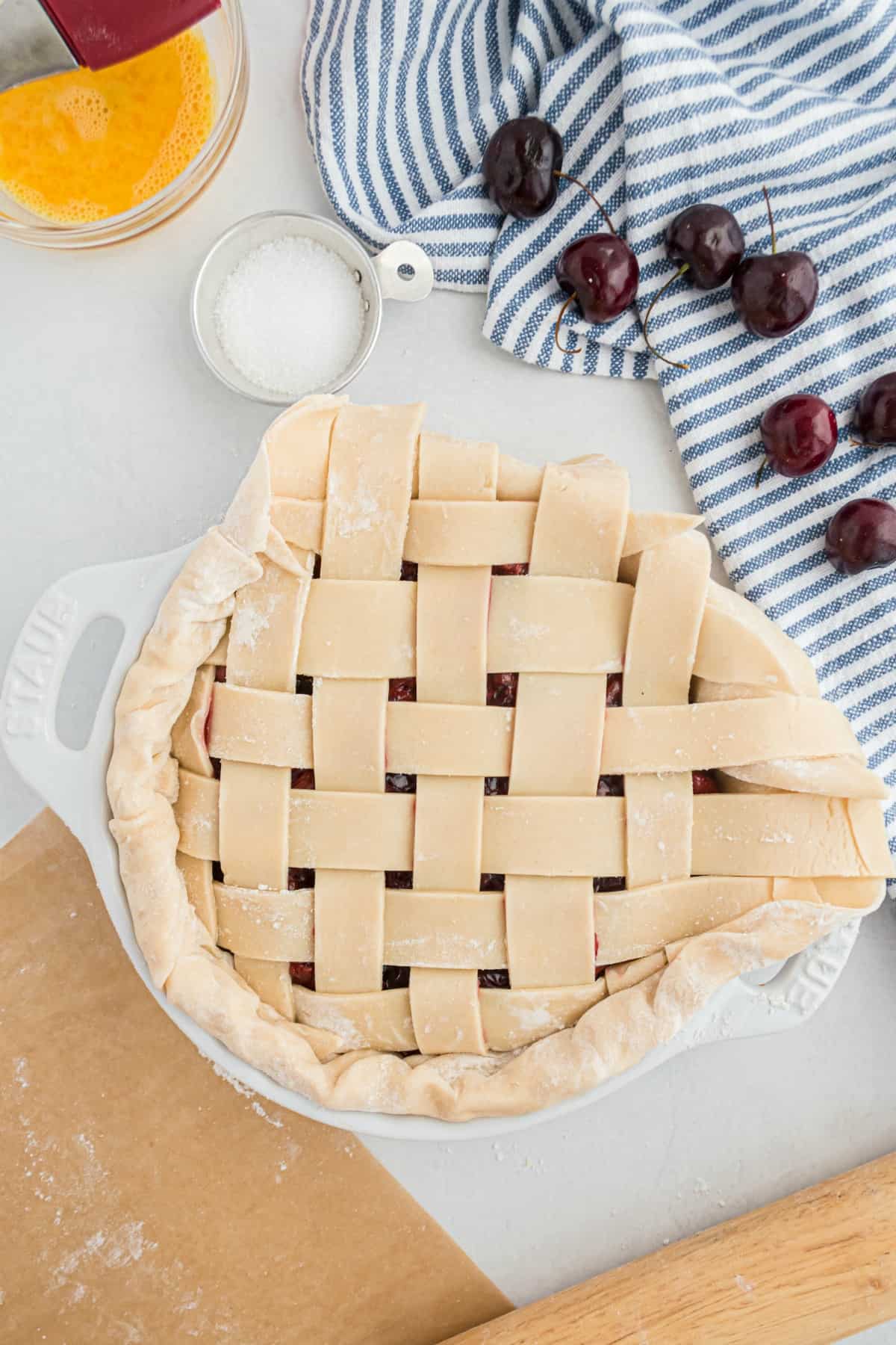 How to fold the edge of a lattice pie crust to make it even.