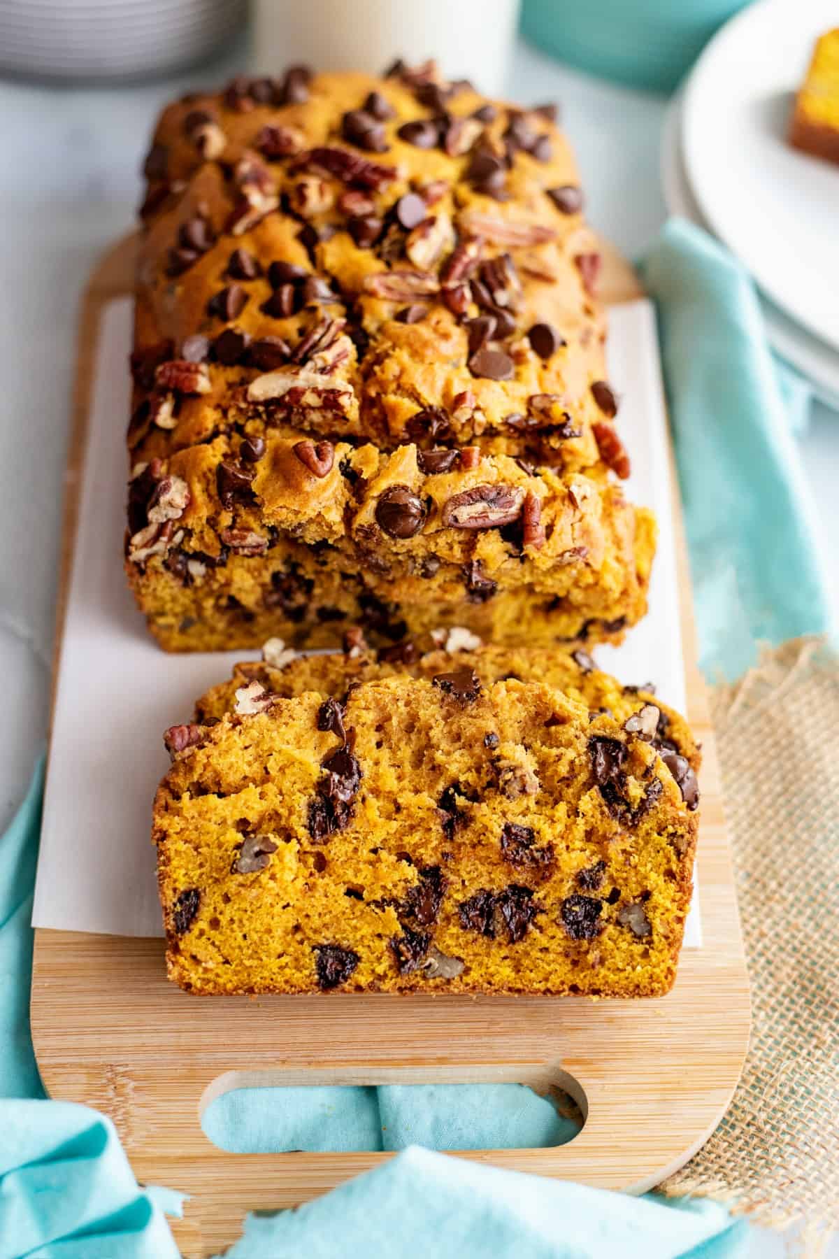 Sliced loaf of pumpkin bread with chocolate chips.