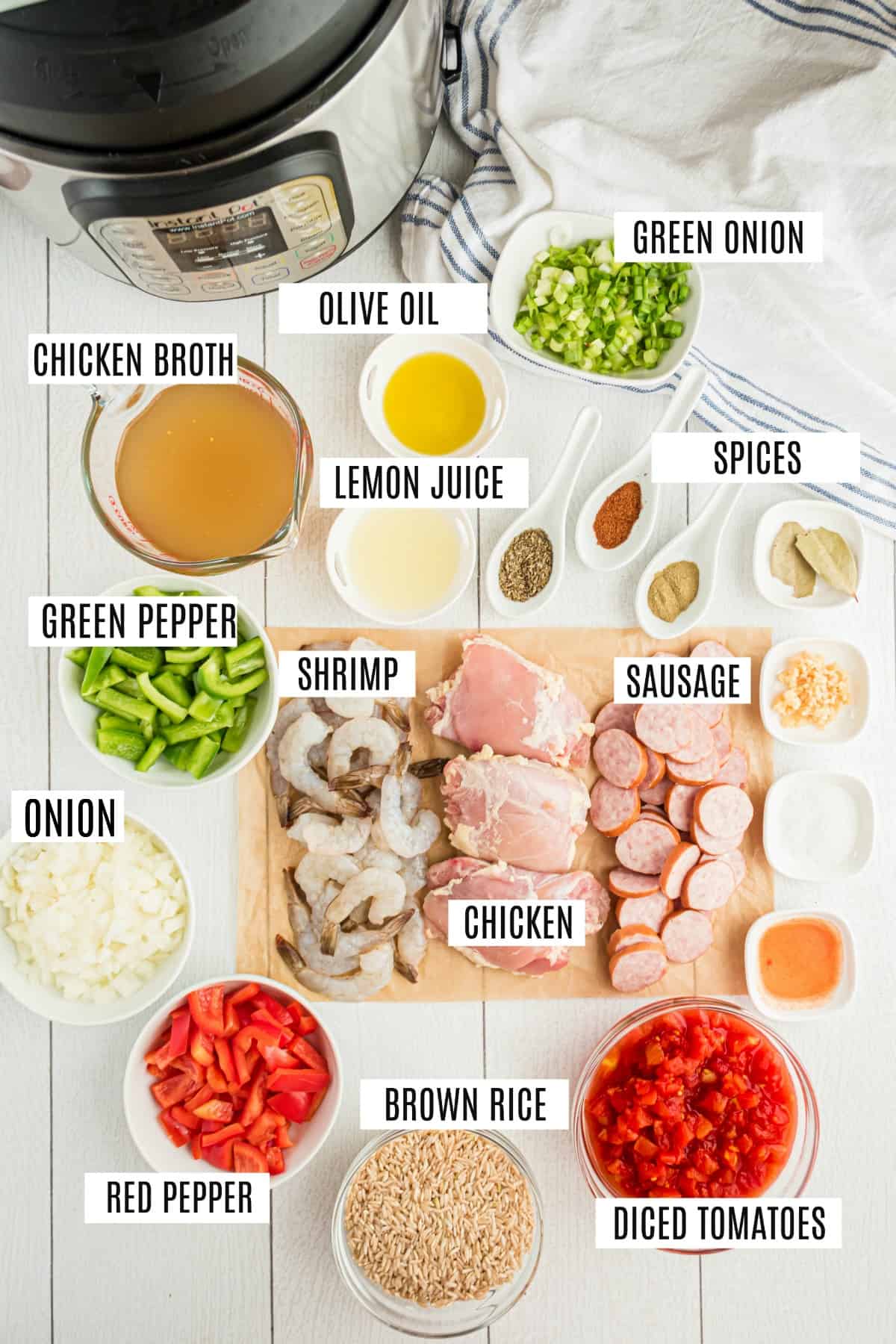 Ingredients needed to make Jambalaya in the Instant Pot, including sausage, chicken, and shrimp.