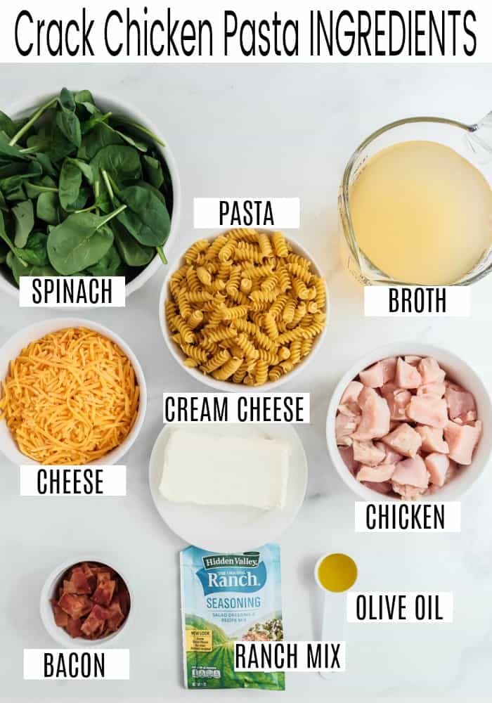 Crack chicken pasta ingredients on a white counter.