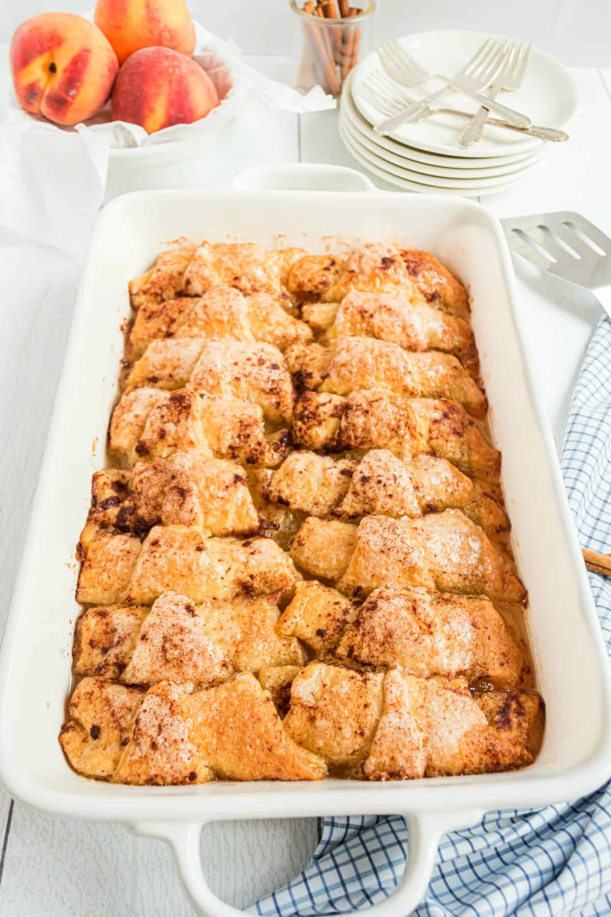 Peach dumplings in a 13x9 baking dish.