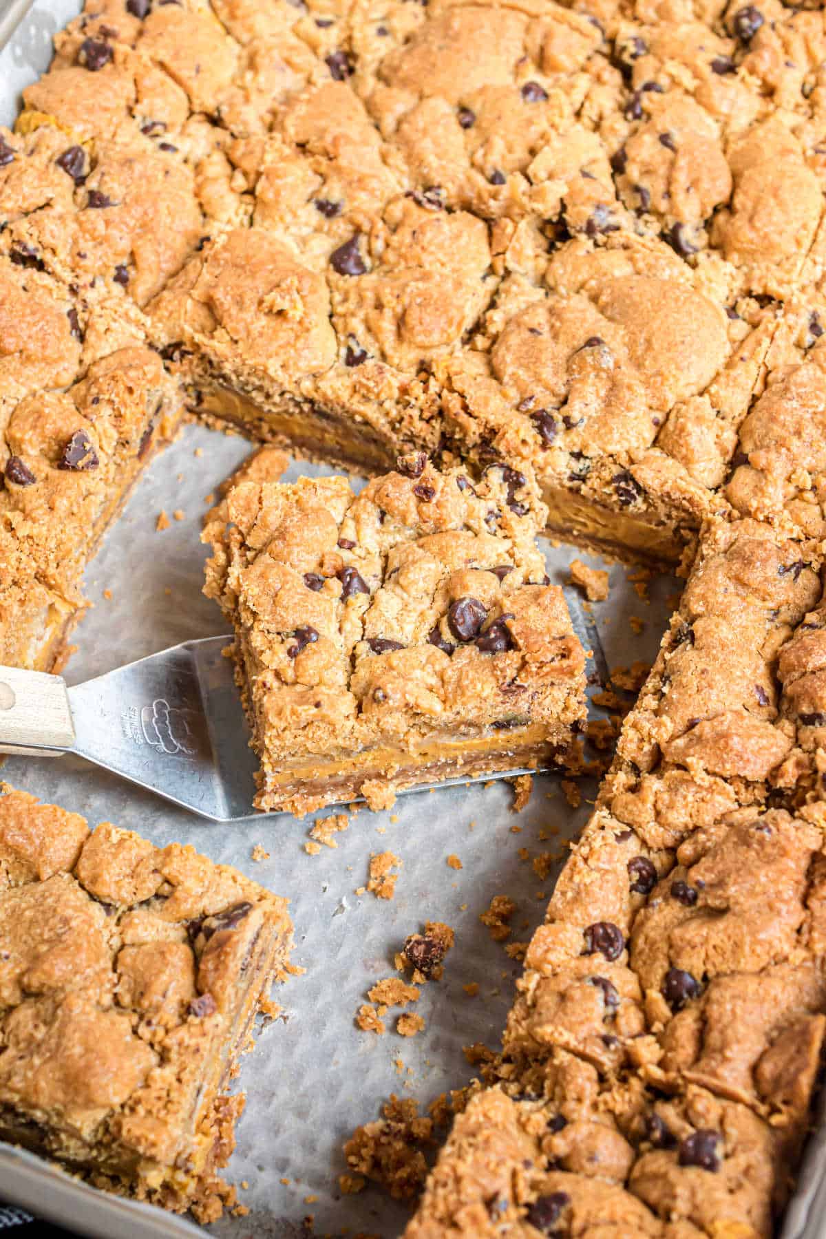 Pumpkin cheesecake bars with chocolate chip cookie topping.