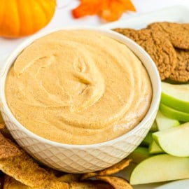 This fluffy Pumpkin Pie Dip is made with Greek Yogurt and fall spices. You'll love this creamy dip served with homemade cinnamon sugar tortilla chips, or serve this no bake treat with apples, pretzels, and more!