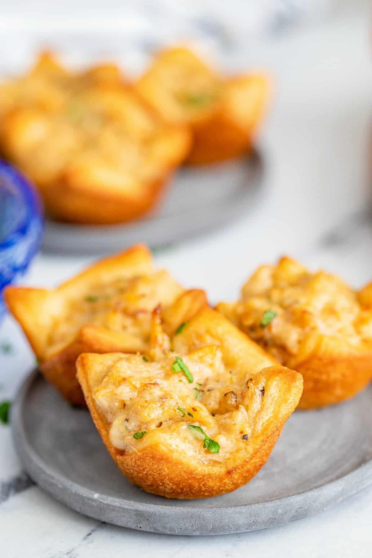 Crab puffs on a plate with parsley.