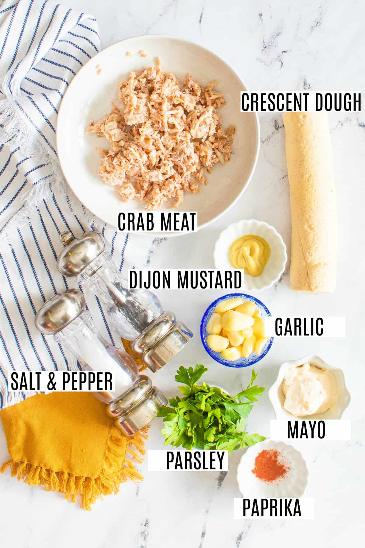 Ingredients for crab puffs on counter surface.