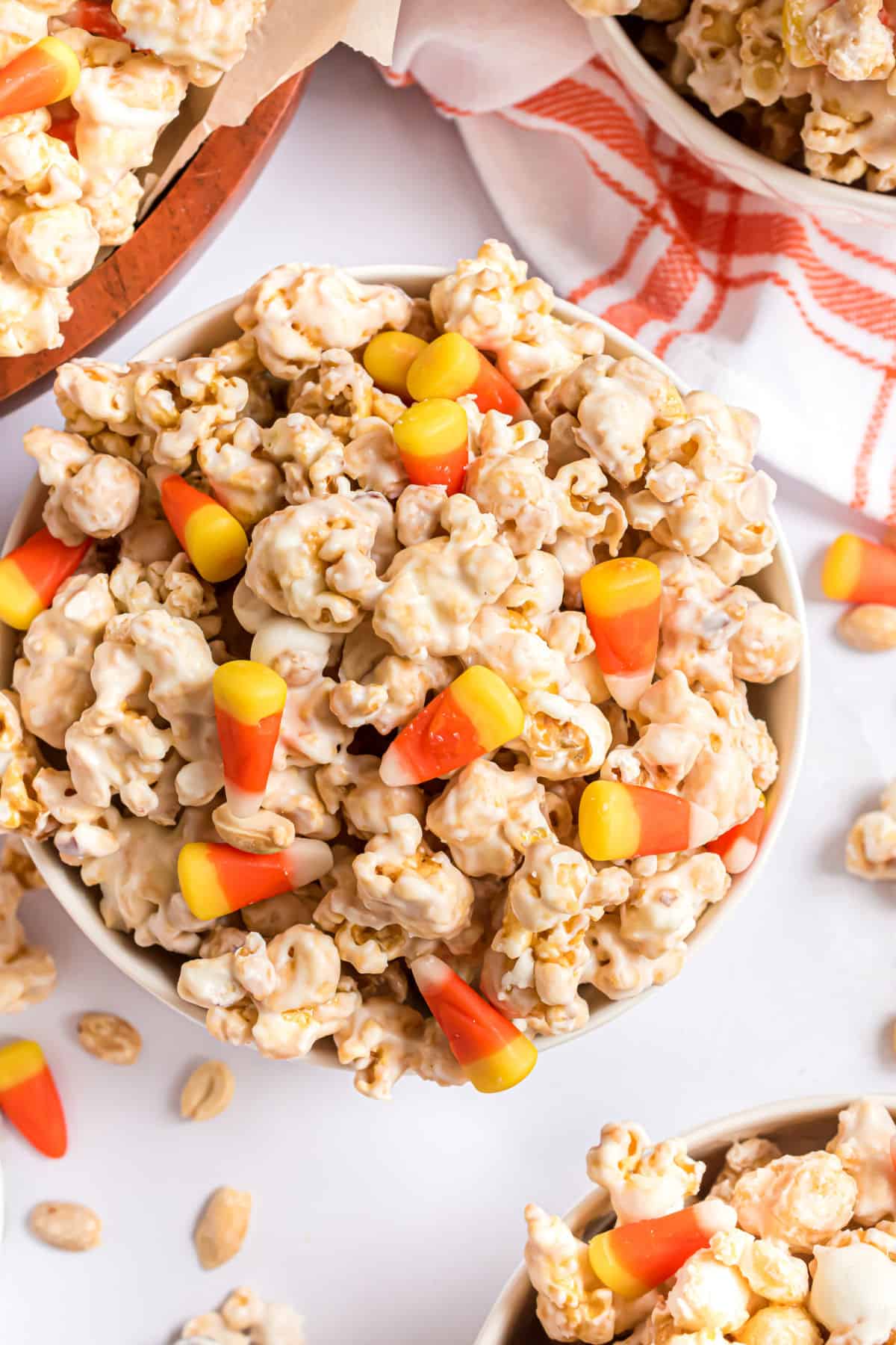 Caramel corn with candy corn in a serving bowl.