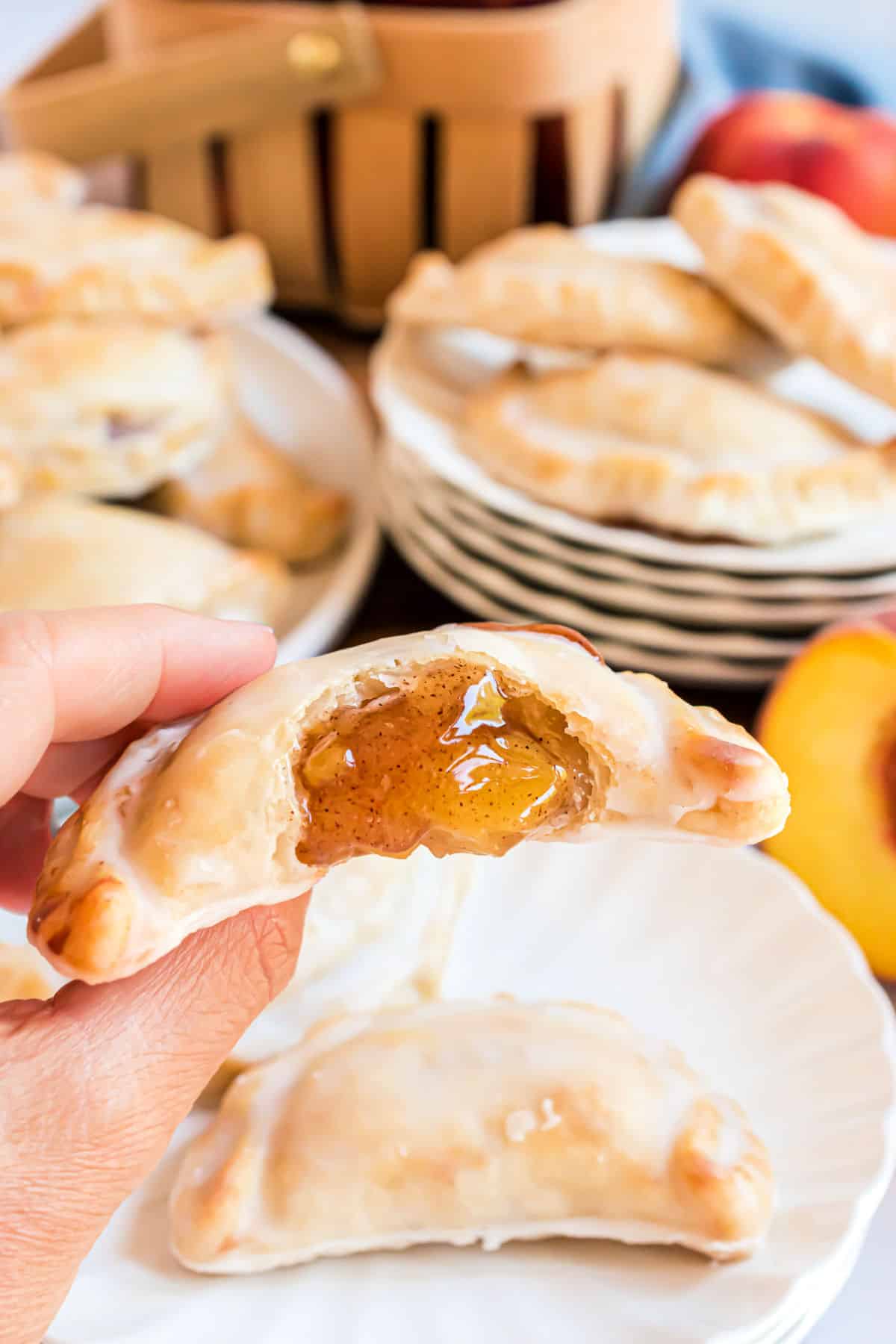 Peach hand pie with a bite taken out.