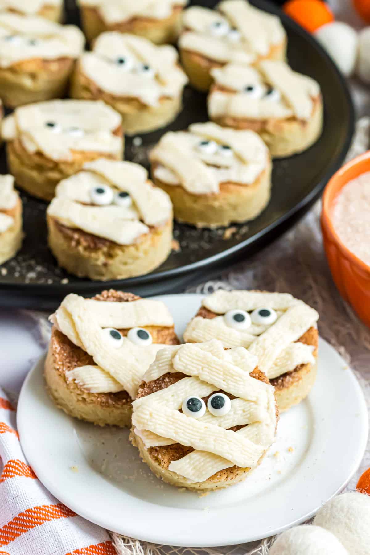 Snickerdoodle cookies decorated as mummies.