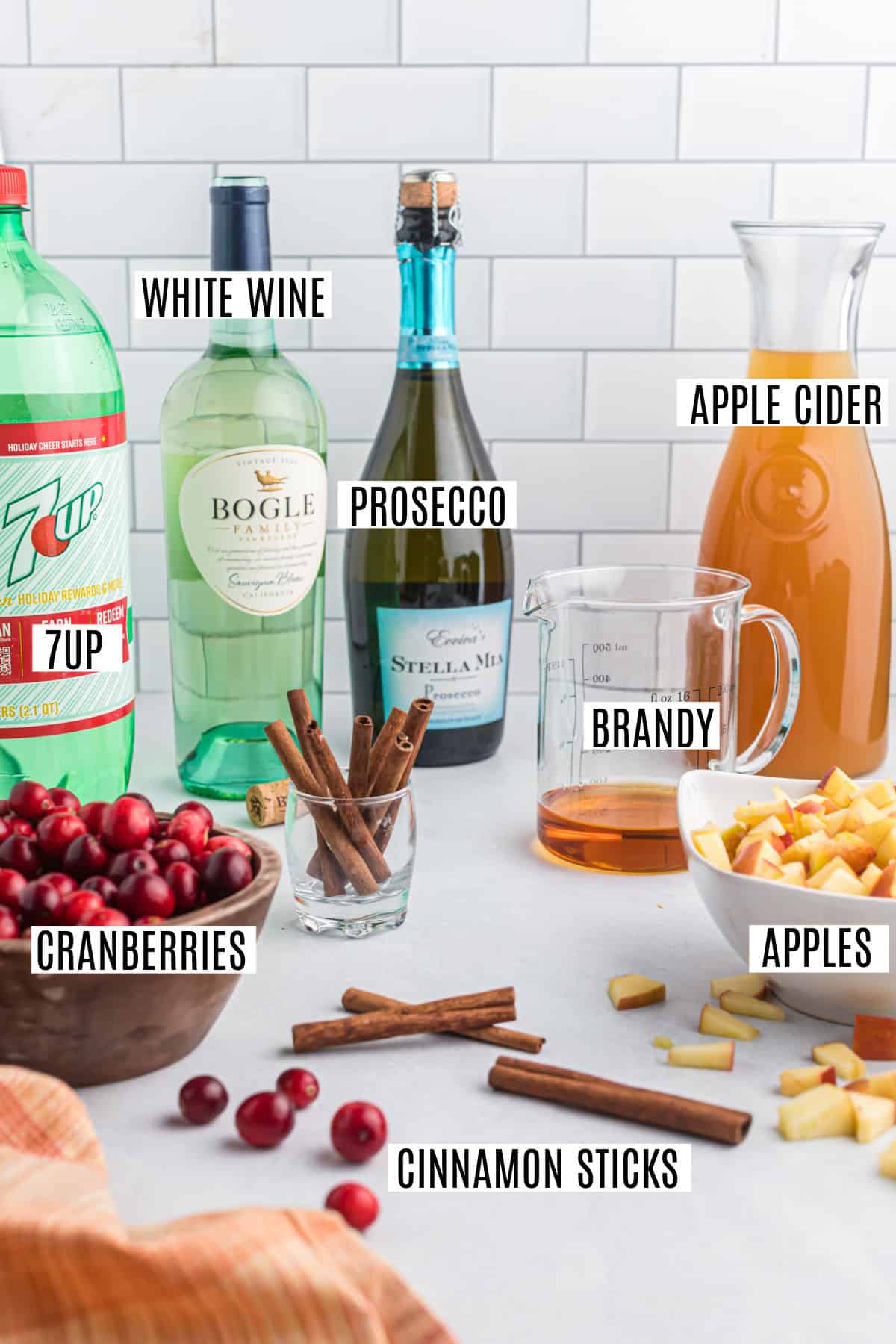 Ingredients needed to make apple cider sangria.