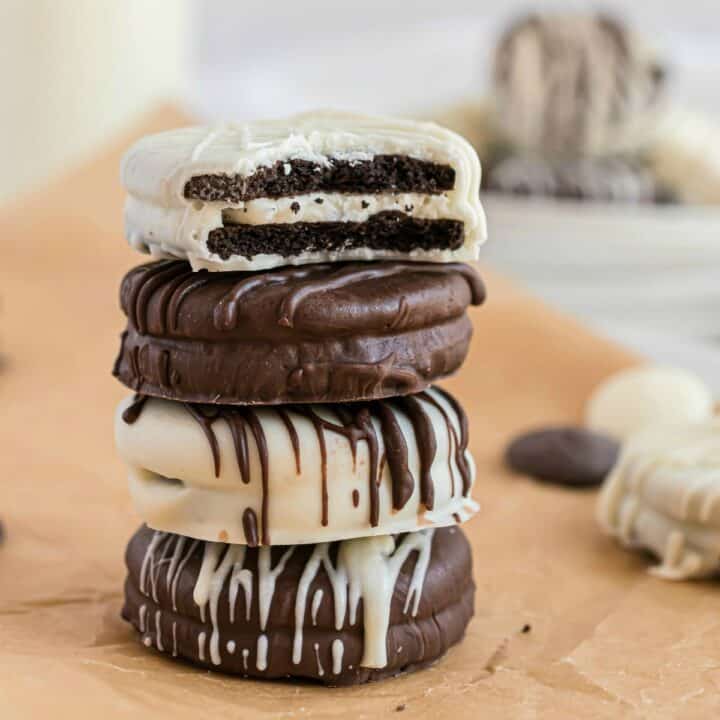 Stack of four chocolate covered oreos.