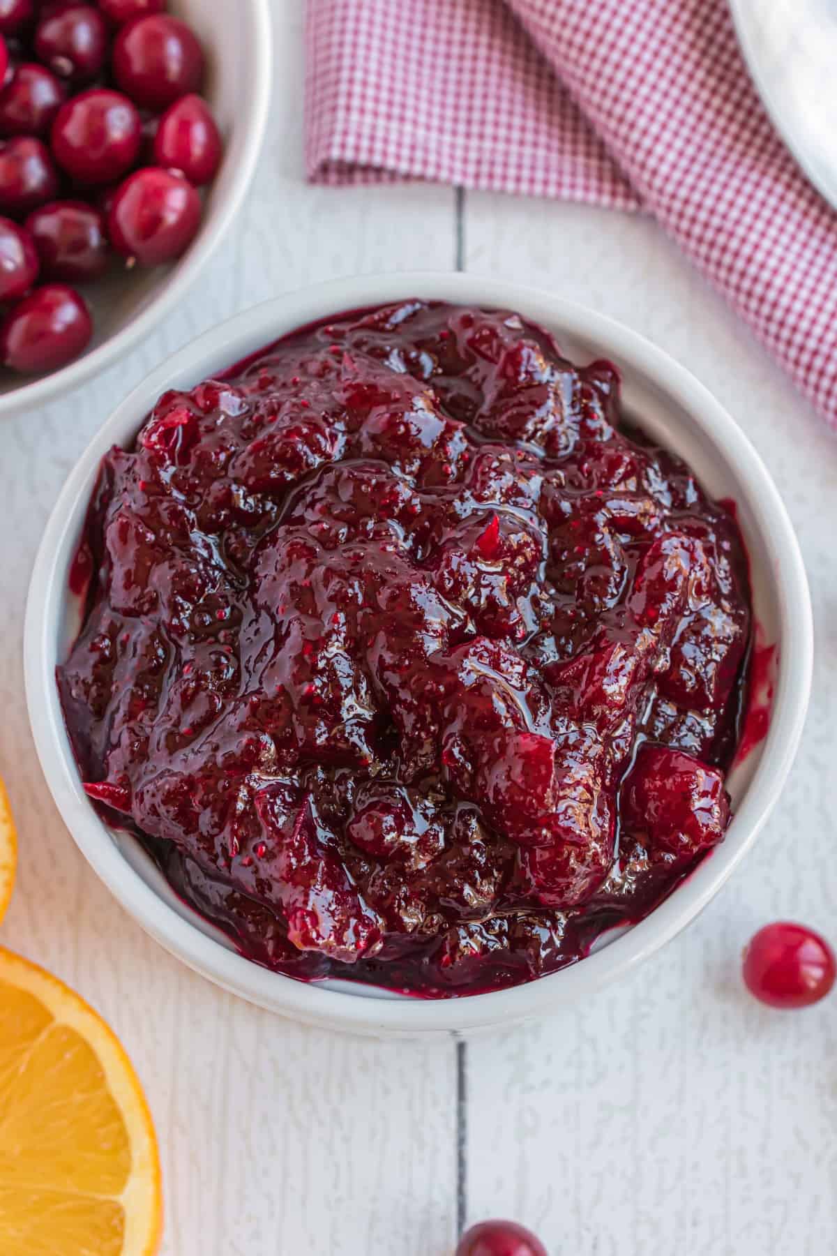 Homemade cranberry sauce in a white bowl.