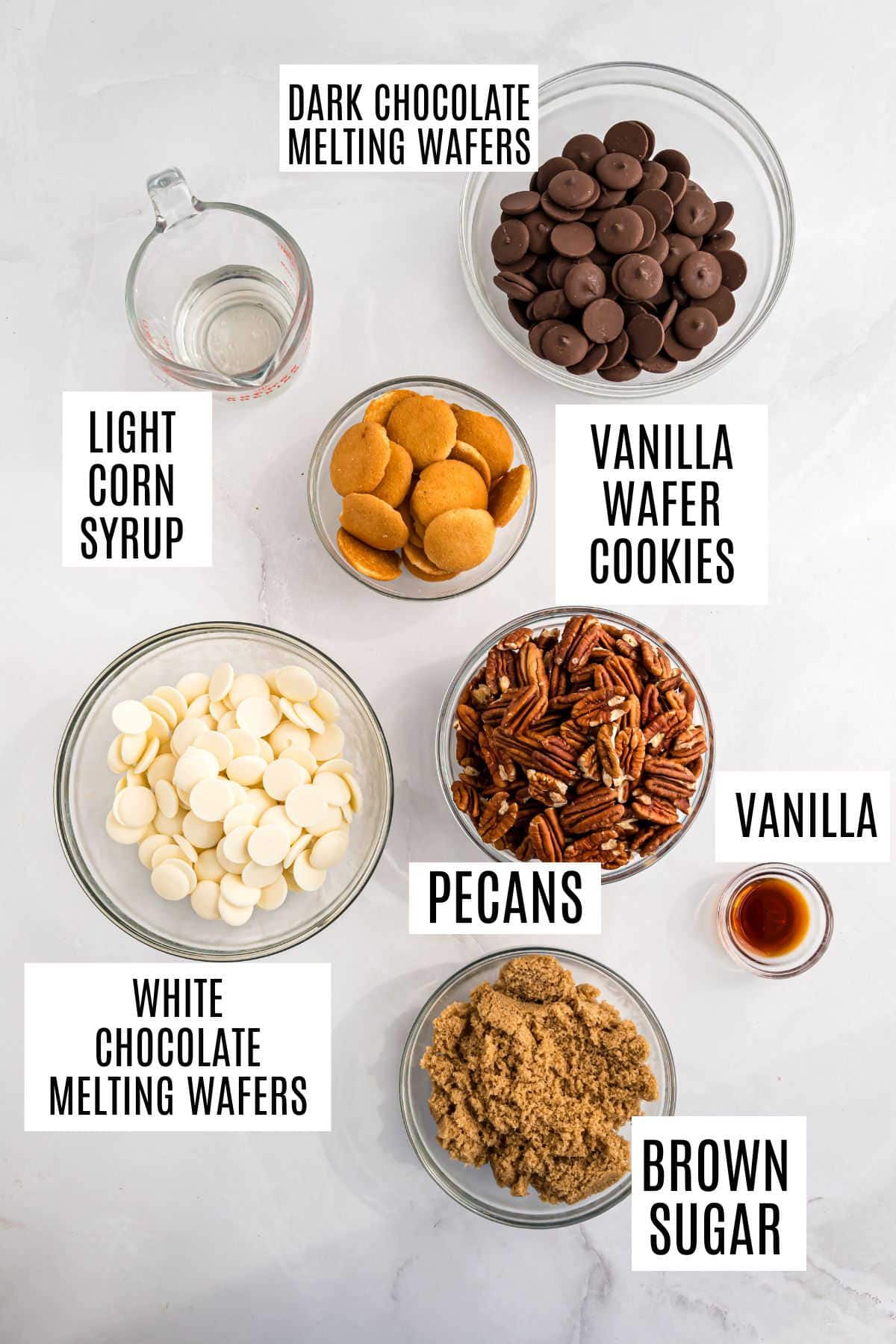 Bowls with labeled ingredients for pecan pie truffles: dark chocolate, white chocolate, cookies, pecans, brown sugar, corn syrup, and vanilla.