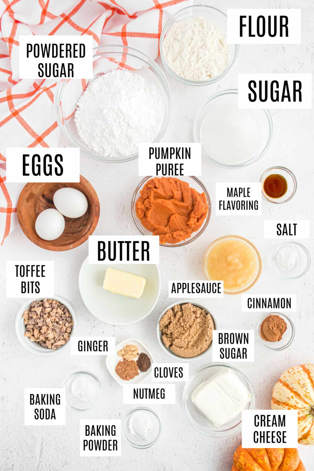 Ingredients needed to make pumpkin cupcakes with cream cheese frosting.