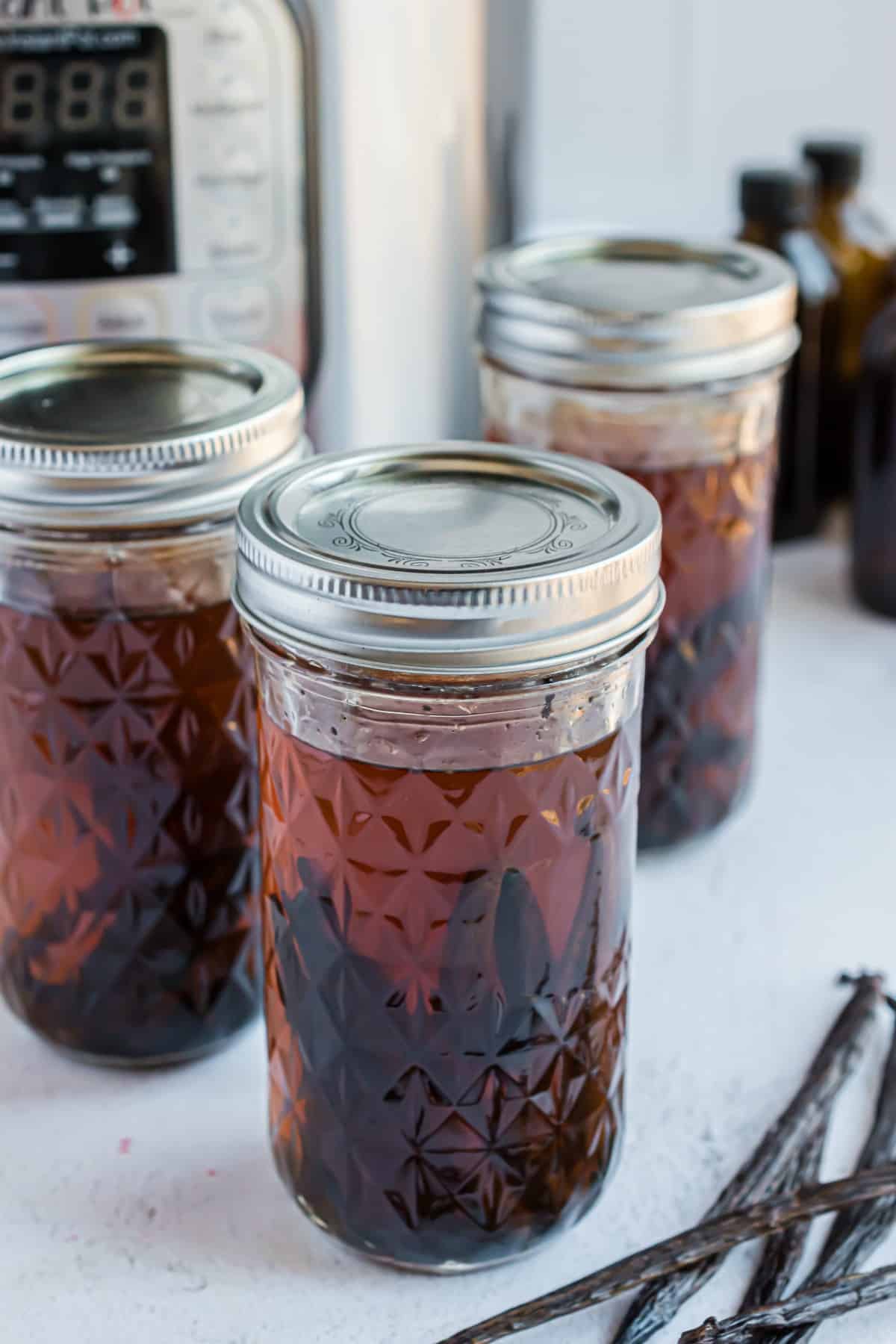 Vanilla extract in canning jars.