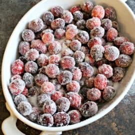 Sugared cranberries in oval baking dish.