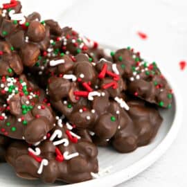Chocolate candy on a plate with sprinkles.