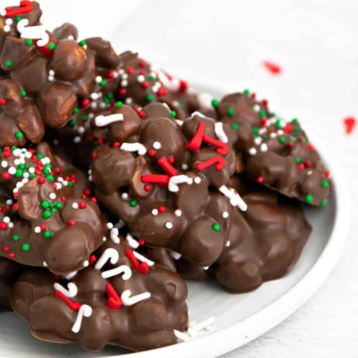 Chocolate candy on a plate with sprinkles.