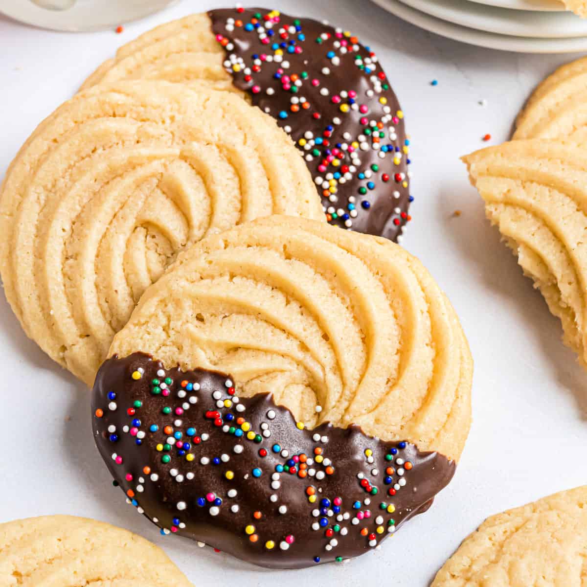 Butter Cookies are the perfect Christmas cookie recipe, but you can enjoy them any time of year. Whether you pipe them, scoop them, or slice and bake these cookies, they’re melt in your mouth delicious!