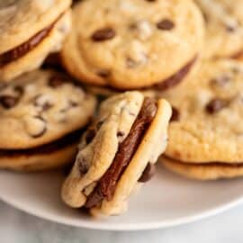 Chocolate chip sandwich cookies with fudge filling.