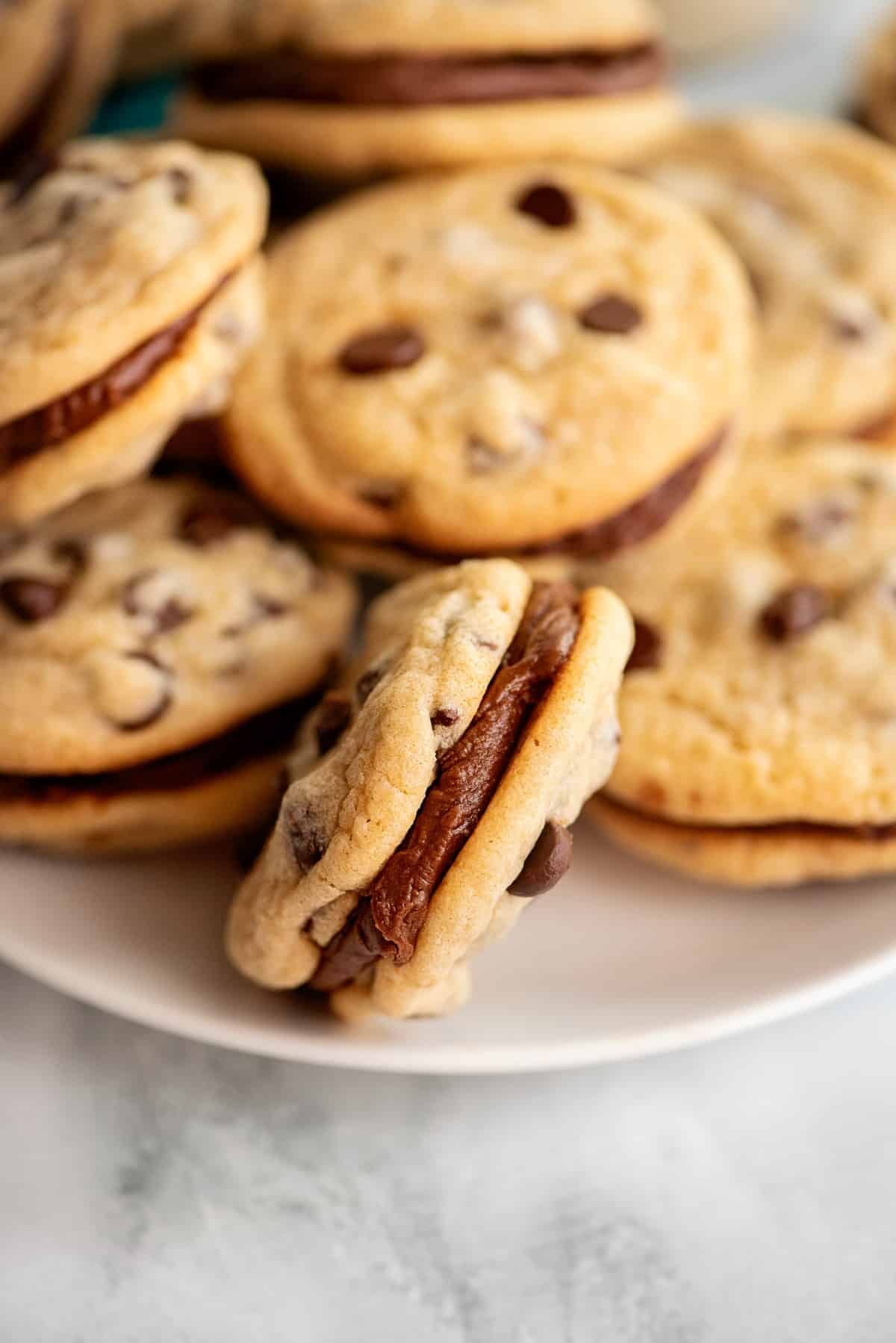 Chocolate chip sandwich cookies with fudge filling.