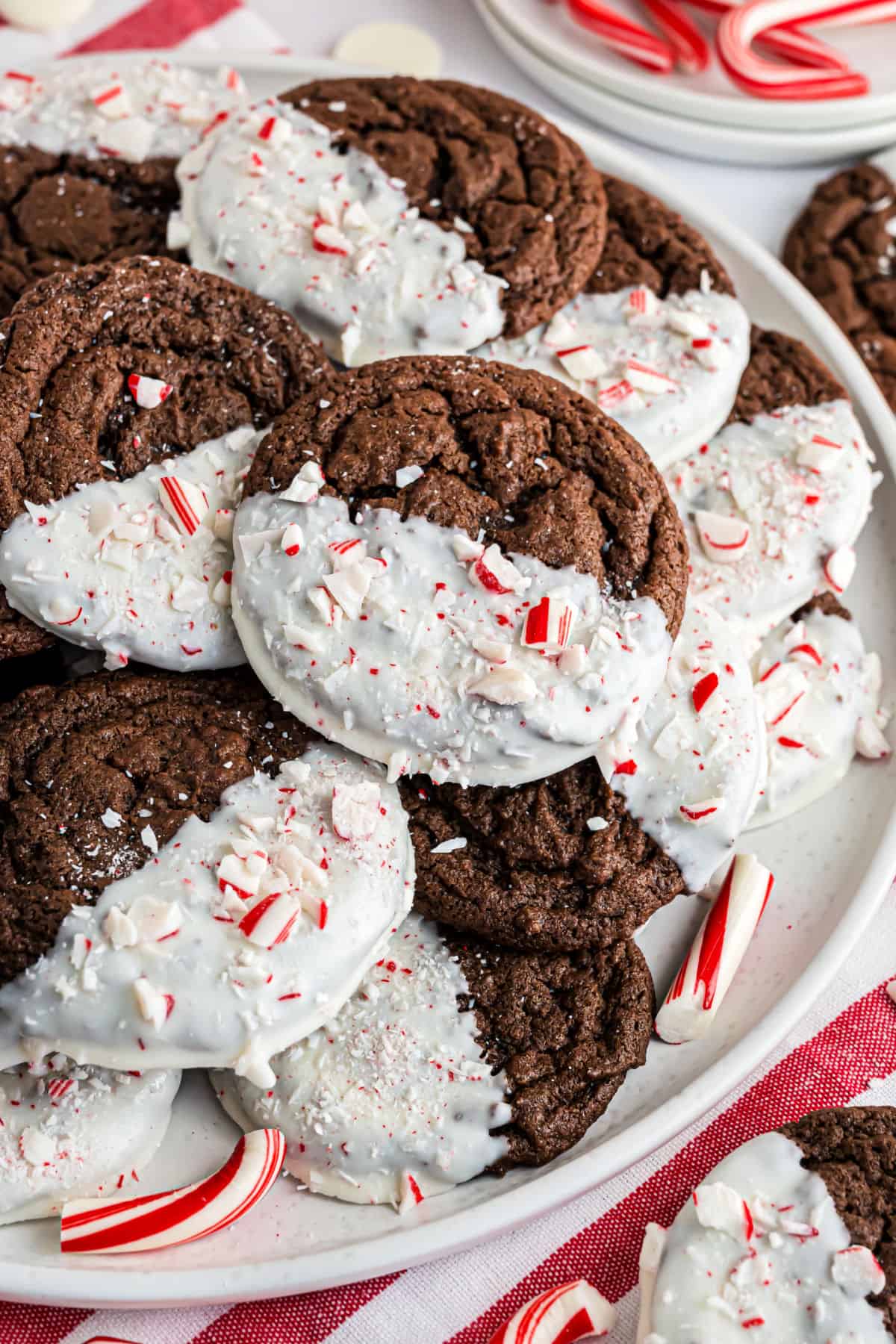 Chocolate cookies dipped in white chocolate and candy cane sprinkles.