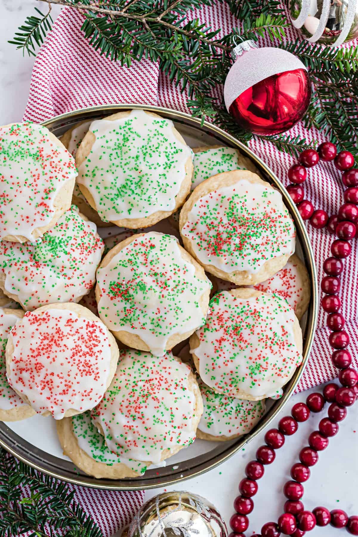 Ricotta cookies with Christmas sprinkles in tin.