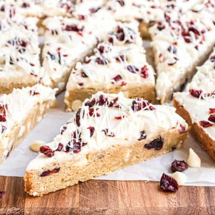 Just like the one you love from the big coffee chain! Everyone loves Cranberry Bliss Bars and with this recipe you can impress your friends with tasty treats without breaking the bank. Chewy blondie base with a cream cheese frosting!