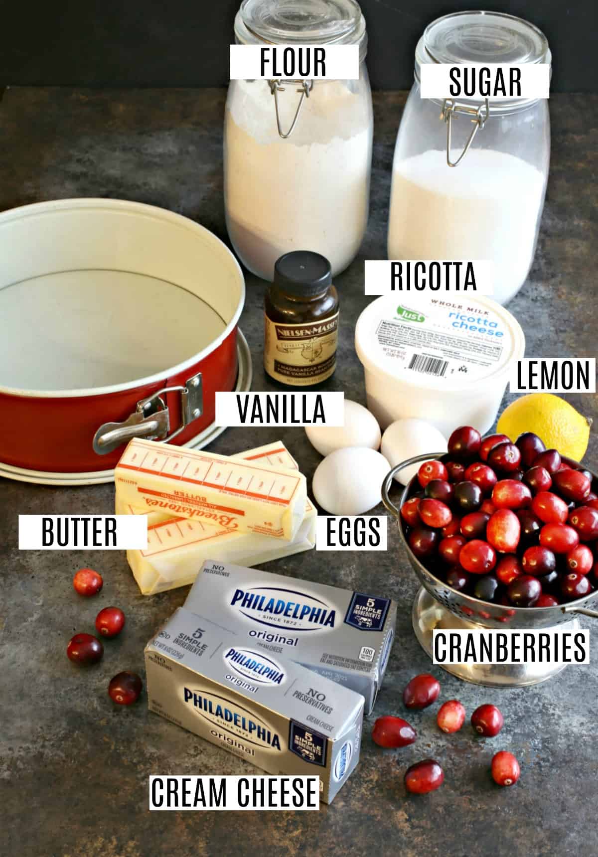 Ingredients needed to make cranberry cheesecake including ricotta and cream cheese.