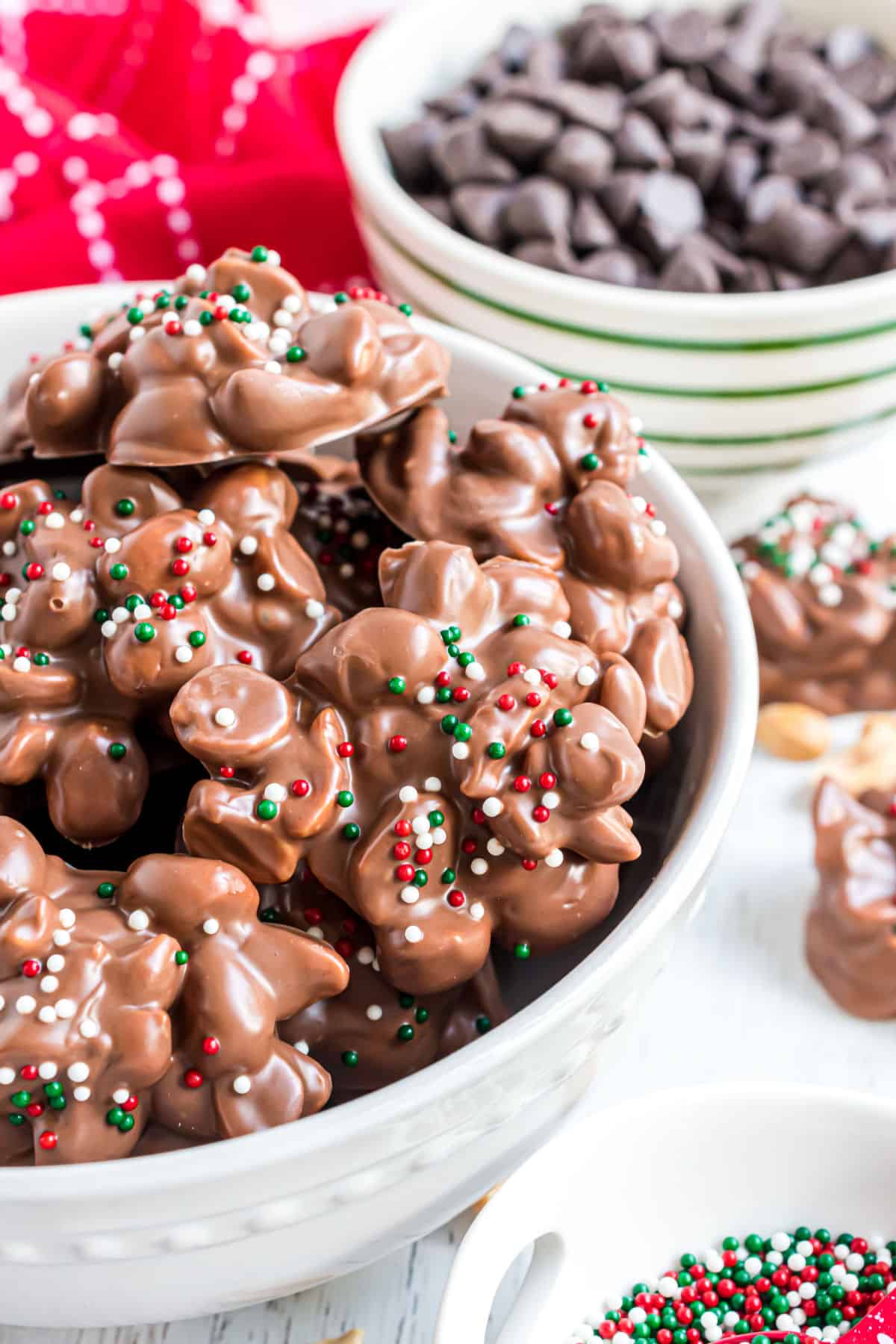 White bowl filled with chocolate peanut candies.